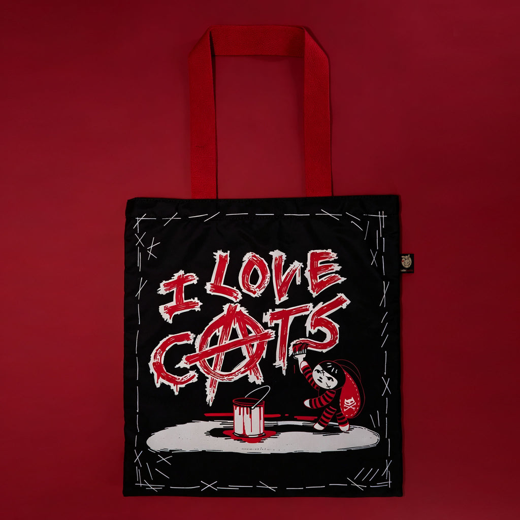 Autographed Emily the Strange and Plushie Dreadful Rabbit collaboration collector set with a black and red goth bunny plush toy, an I Love Cats canvas tote bag, ink pen, coin purse, and signed card by American McGee and Rob Reger.