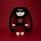 Autographed Emily the Strange and Plushie Dreadful Rabbit collaboration collector set with a black and red goth bunny plush toy, an I Love Cats canvas tote bag, ink pen, coin purse, and signed card by American McGee and Rob Reger.