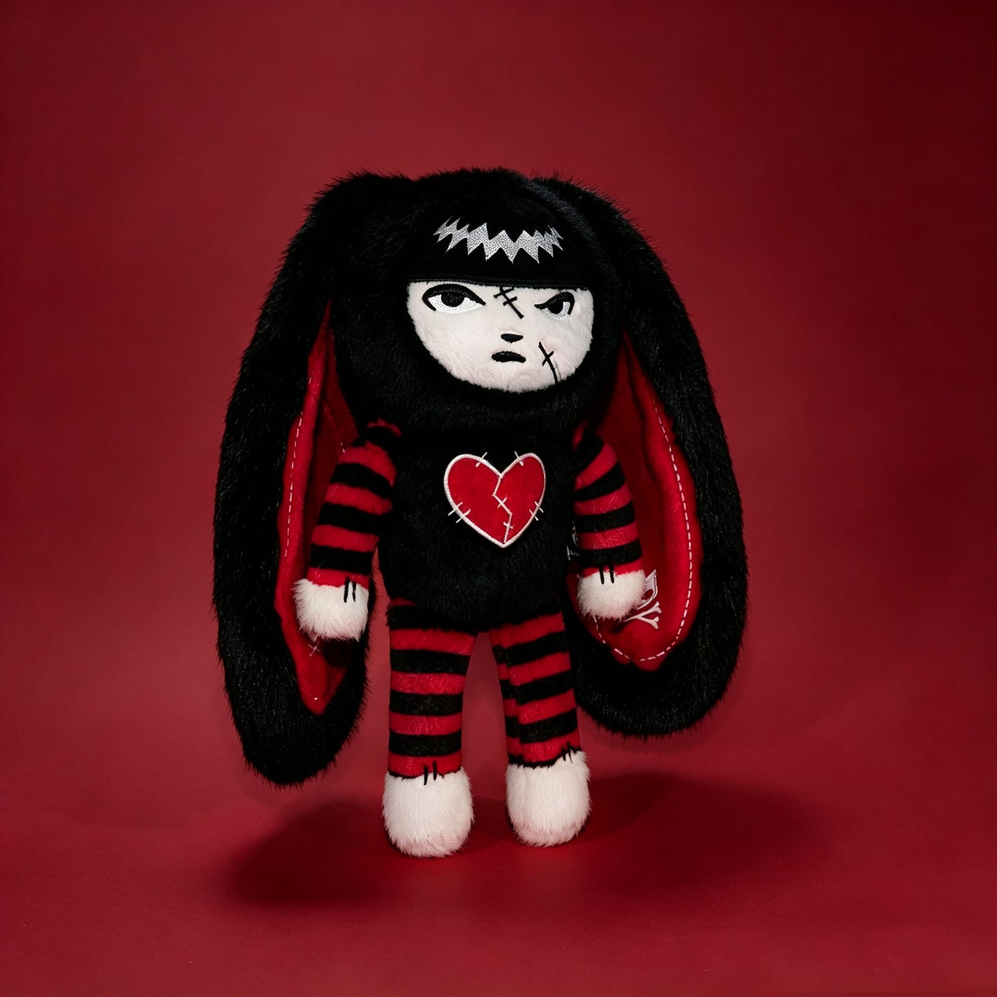 Autographed Emily the Strange and Plushie Dreadful Rabbit collaboration collector set with a black and red goth bunny plush toy, an I Love Cats canvas tote bag, ink pen, coin purse, and signed card by American McGee and Rob Reger.