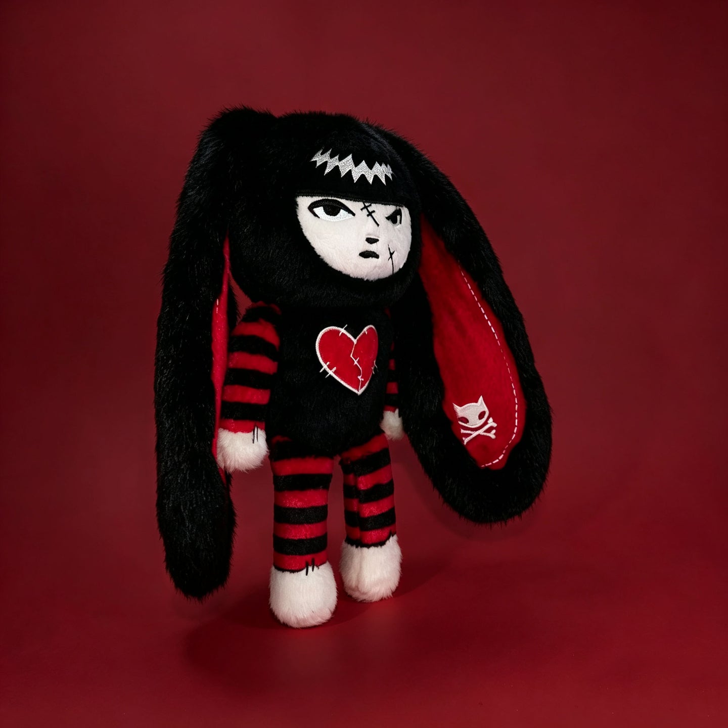 Autographed Emily the Strange and Plushie Dreadful Rabbit collaboration collector set with a black and red goth bunny plush toy, an I Love Cats canvas tote bag, ink pen, coin purse, and signed card by American McGee and Rob Reger.