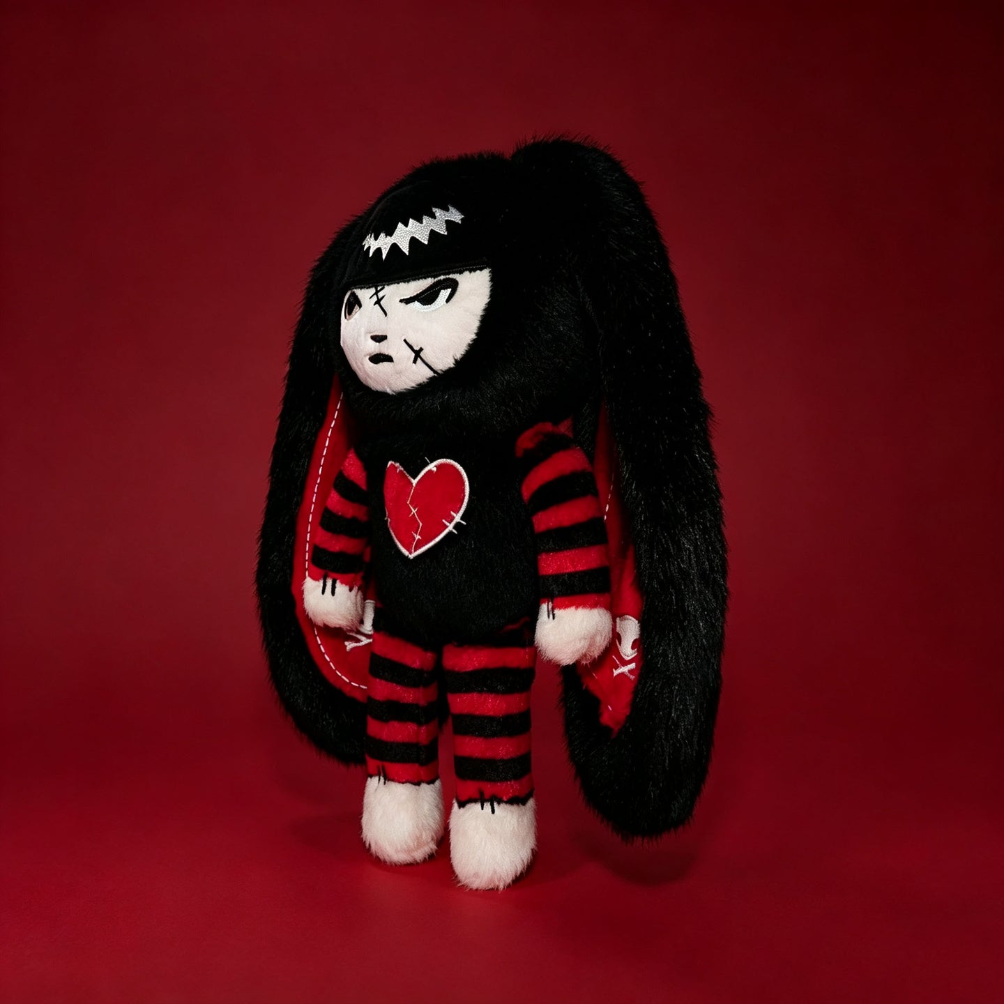 Autographed Emily the Strange and Plushie Dreadful Rabbit collaboration collector set with a black and red goth bunny plush toy, an I Love Cats canvas tote bag, ink pen, coin purse, and signed card by American McGee and Rob Reger.