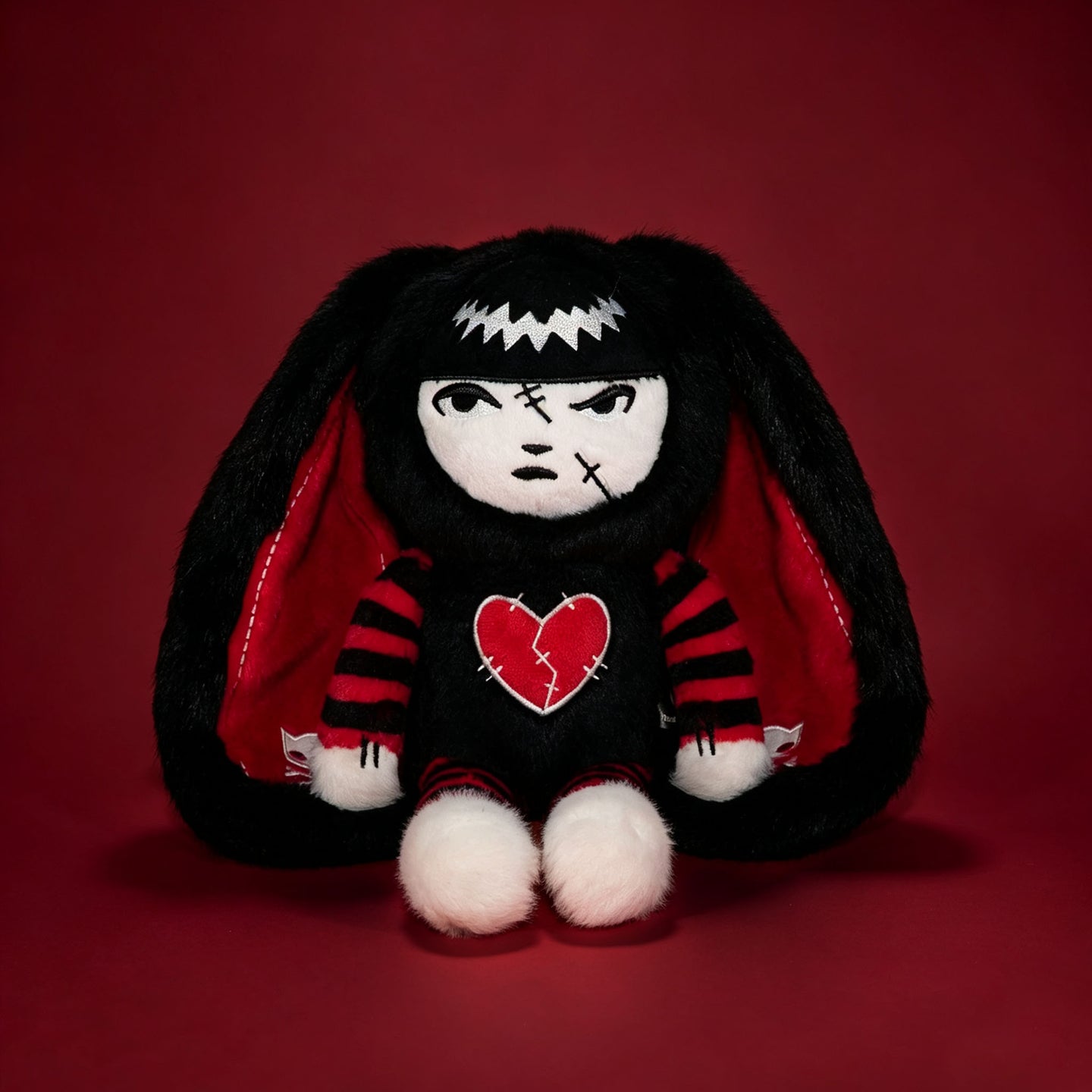 Autographed Emily the Strange and Plushie Dreadful Rabbit collaboration collector set with a black and red goth bunny plush toy, an I Love Cats canvas tote bag, ink pen, coin purse, and signed card by American McGee and Rob Reger.