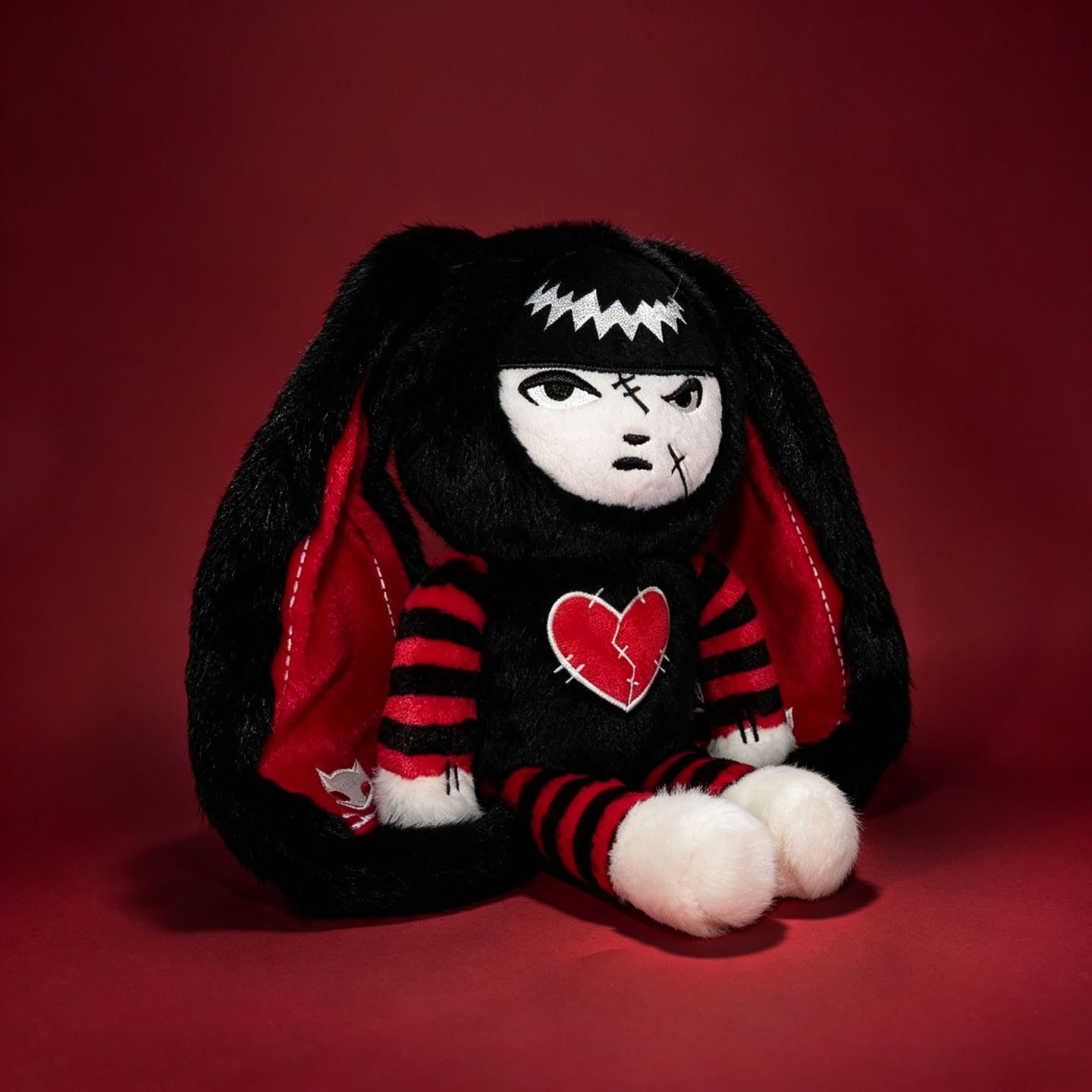 Autographed Emily the Strange and Plushie Dreadful Rabbit collaboration collector set with a black and red goth bunny plush toy, an I Love Cats canvas tote bag, ink pen, coin purse, and signed card by American McGee and Rob Reger.