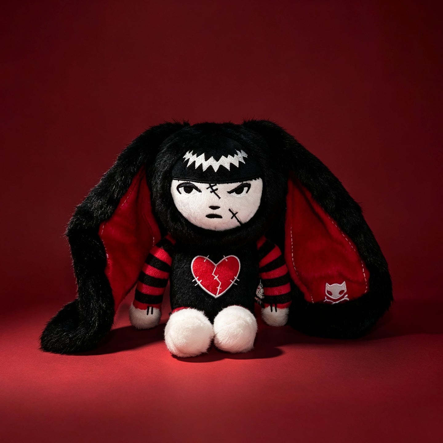 Autographed Emily the Strange and Plushie Dreadful Rabbit collaboration collector set with a black and red goth bunny plush toy, an I Love Cats canvas tote bag, ink pen, coin purse, and signed card by American McGee and Rob Reger.