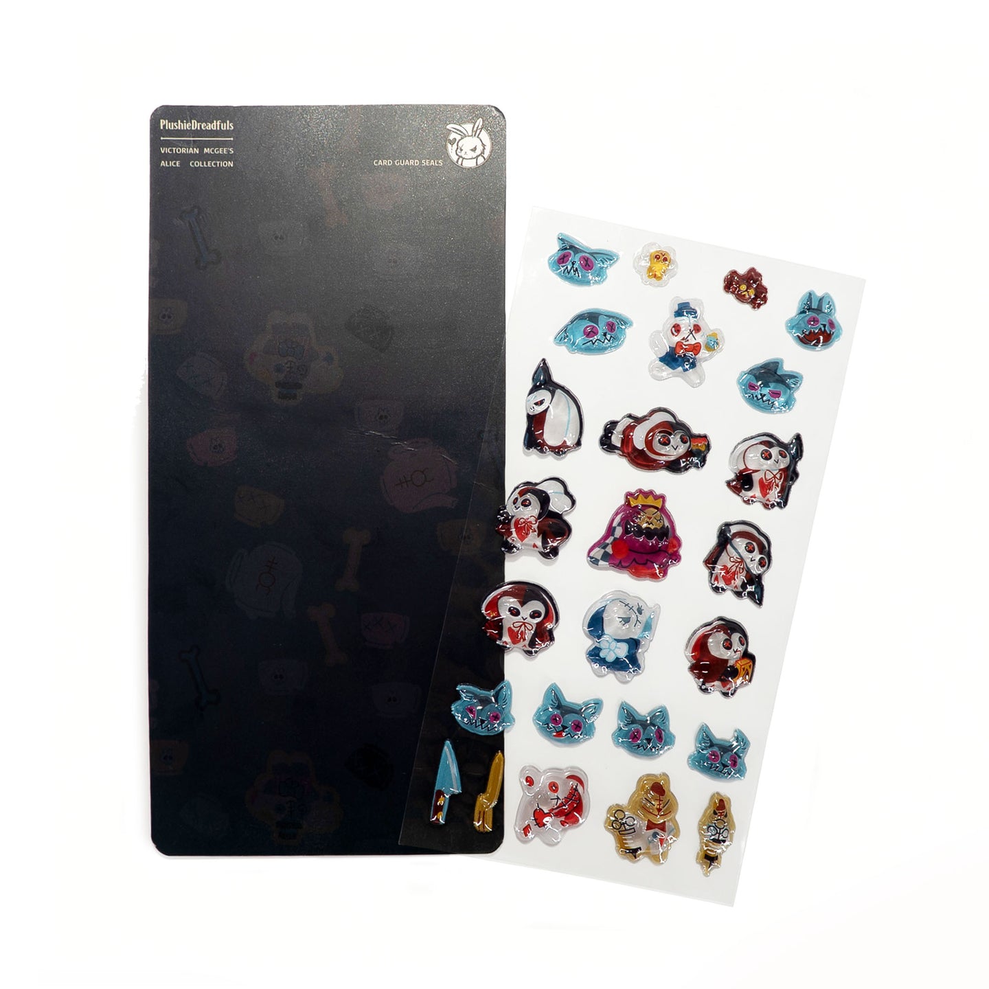 A sheet of colorful cartoon character stickers displayed next to a black backing board on a plain white background. The stickers feature various paws, cats, and fantasy characters in red, blue, white, and gold.