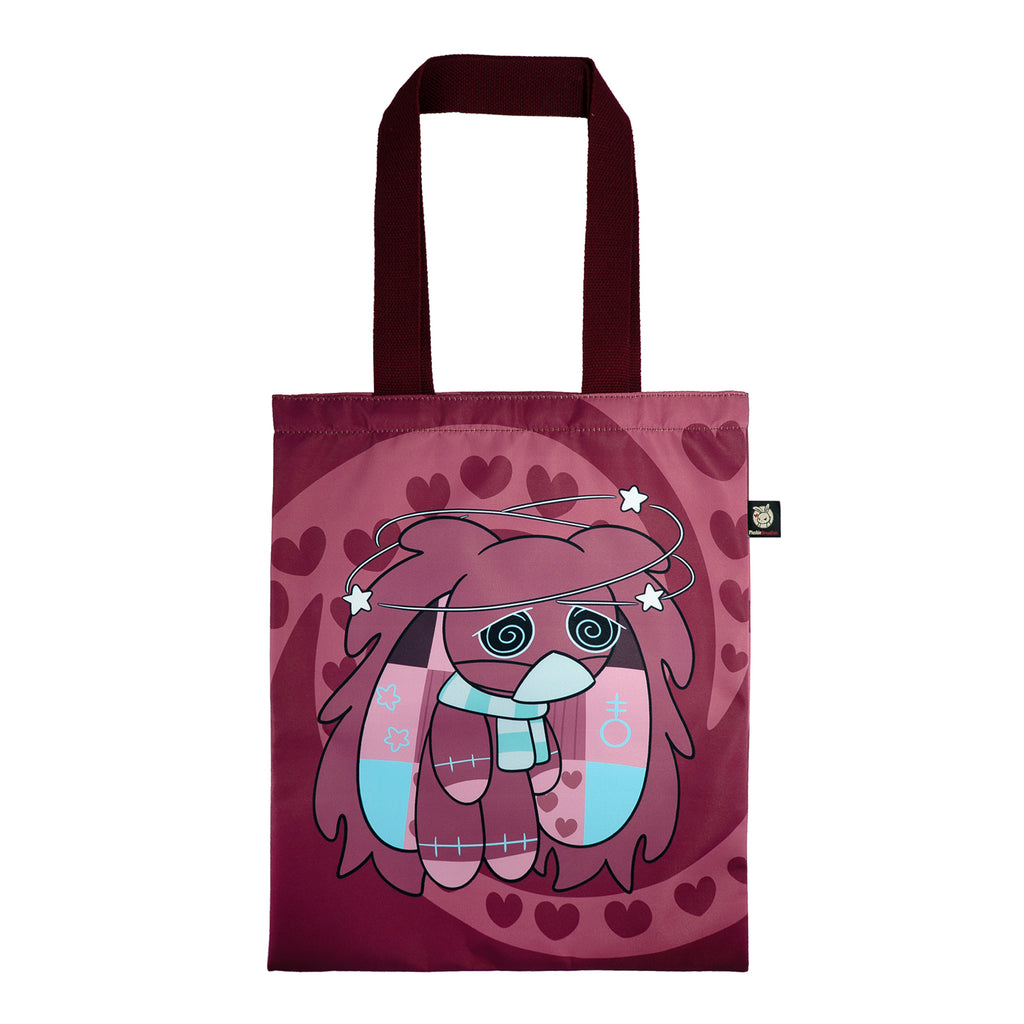 Maroon tote bag with awareness rabbit cartoon, heart patterns, swirly eyes, patchwork details, and dark handles.