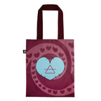 Maroon tote bag with stitched edges, blue heart, and swirling maroon hearts—perfect as a chronic illness gift.