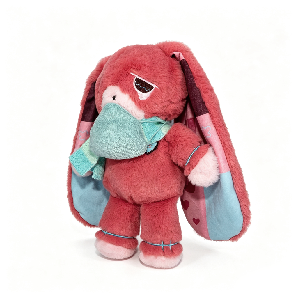 Pink plush bunny with long ears, a teal scarf and mask—an awareness rabbit plushie symbolizing chronic illness.