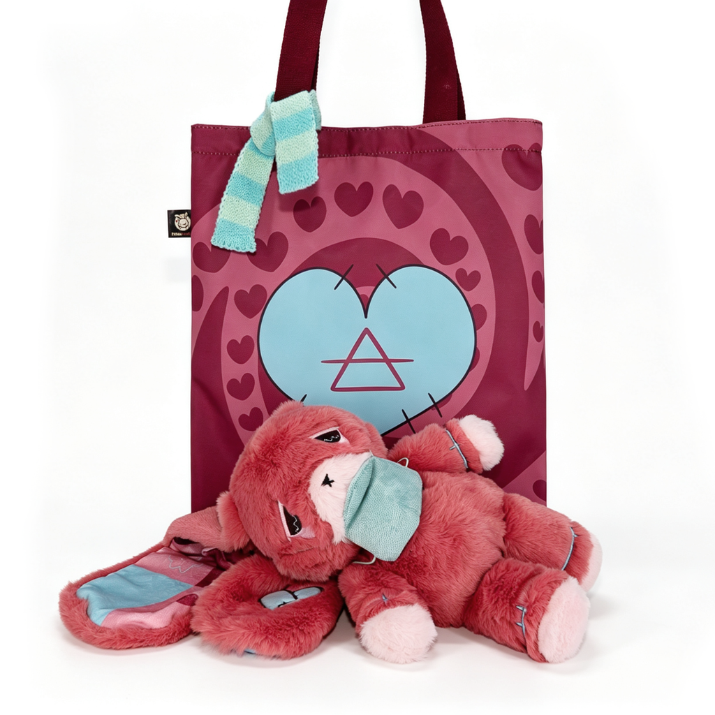 A plush awareness rabbit with a teal mask lies before a maroon heart tote—an ideal chronic illness gift.