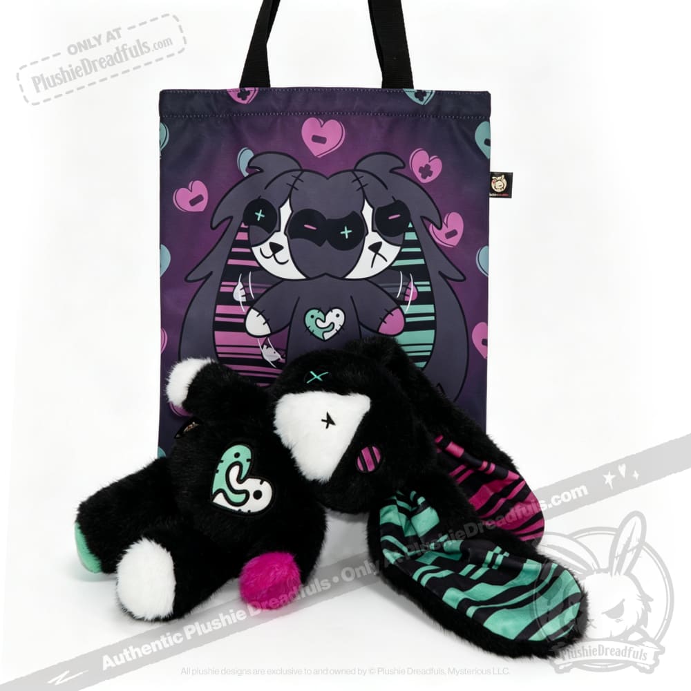 A plush black bunny, the perfect mental health gift, sits with a matching illustrated tote bag.