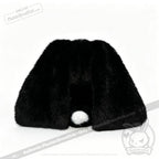 A black, furry object with long ear-like shapes and a small white ball—an ideal mental health gift resembling a bunny.