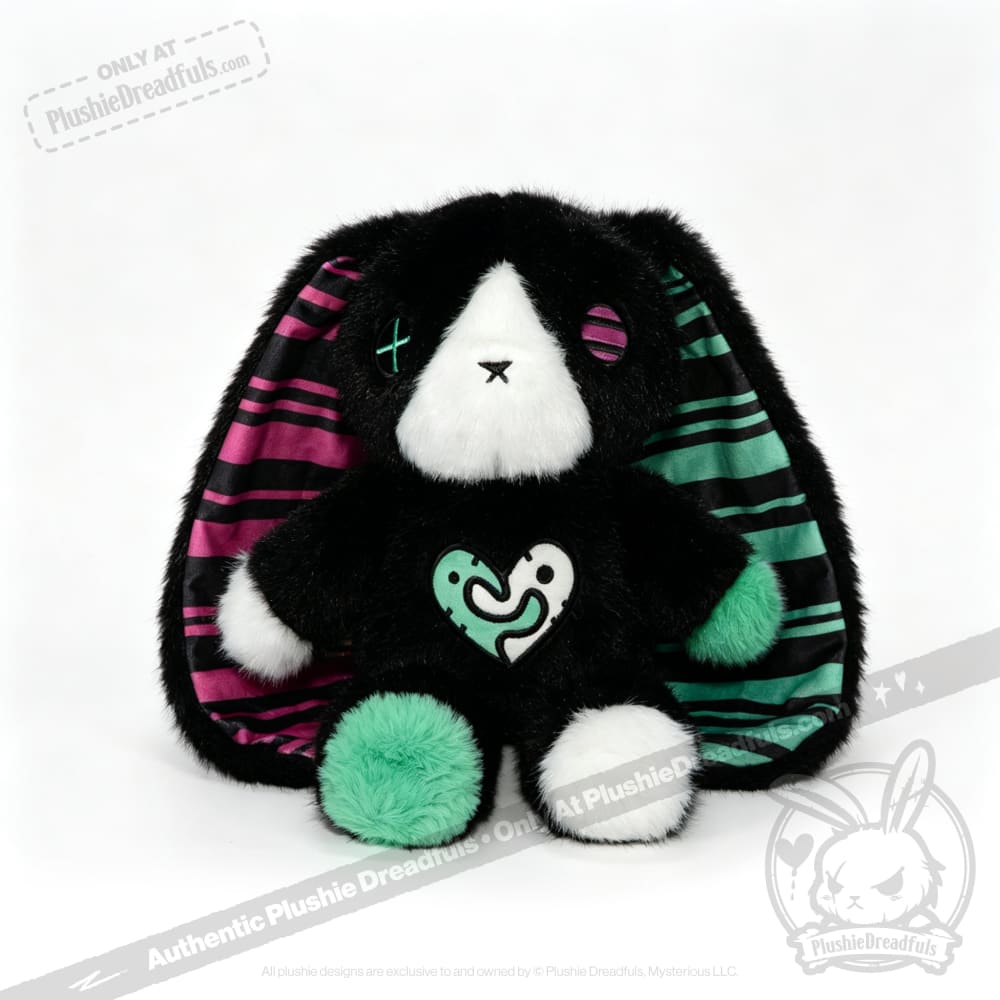 Plush black bunny with striped ears, mismatched eyes—a unique emotional support bunny and thoughtful mental health gift.