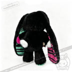 A black plush bunny with striped ears, perfect as an emotional support bunny or thoughtful mental health gift.