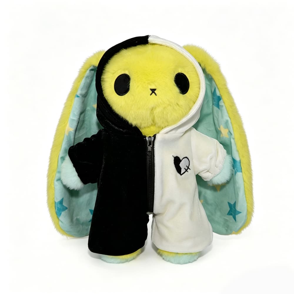 Regular sized Plushie Dreadfuls bunny in a black-and-white hoodie, yellow fur, blue paws, and star-print ears.