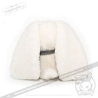 Plush white bunny toy faces backward, its floppy ears and round tail evoke seas of love on a crisp white background.