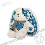 Plush white bunny with blue patchwork details, checkered ears, and gray scarf—your Blueplaid plush for Seas of Love.