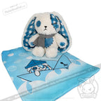 Plush white and blue patchwork bunny on a matching blue mat, inspired by Seas of Love and adorable Blueplaid plush charm.