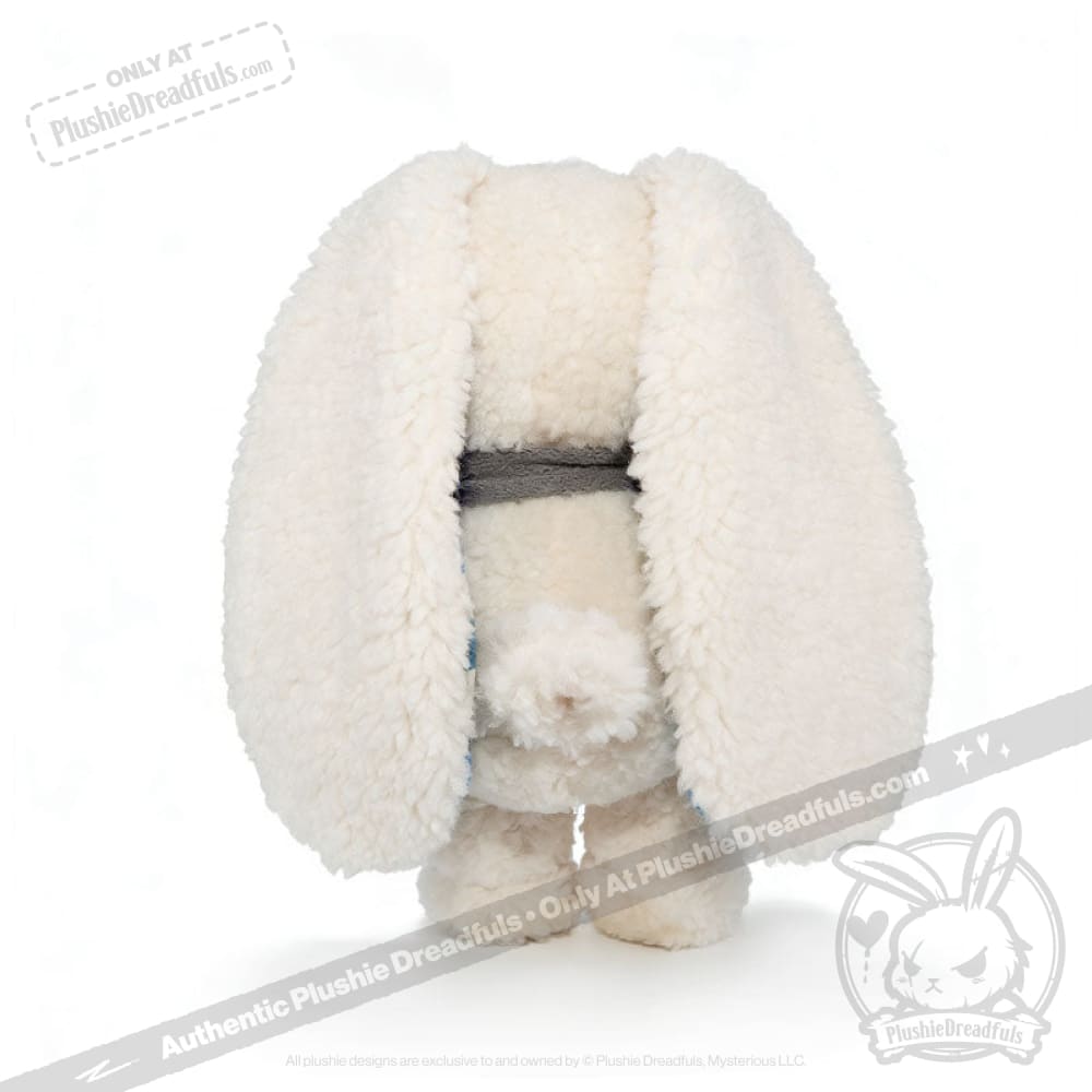Fluffy white Blueplaid plush toy with long ears, facing backward, stands on a white background.