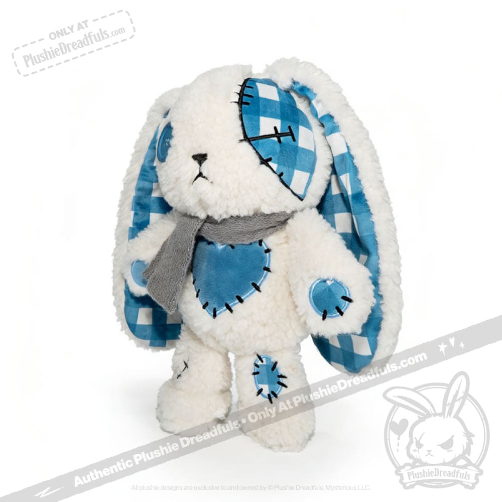 Blueplaid plush bunny with a grey scarf, button eye, and floppy ears lined with blue checkered fabric.
