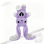 Purple plush toy bunny with long floppy ears, black broken-heart and semicolon symbol for depression awareness.