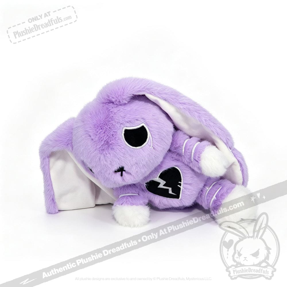 Purple plush bunny with floppy ears, black heart patch, and sad eyes—LIMITED EDITION for depression awareness.