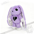 LIMITED EDITION plush purple bunny with floppy ears, a sad black eye, and a broken heart for depression awareness.