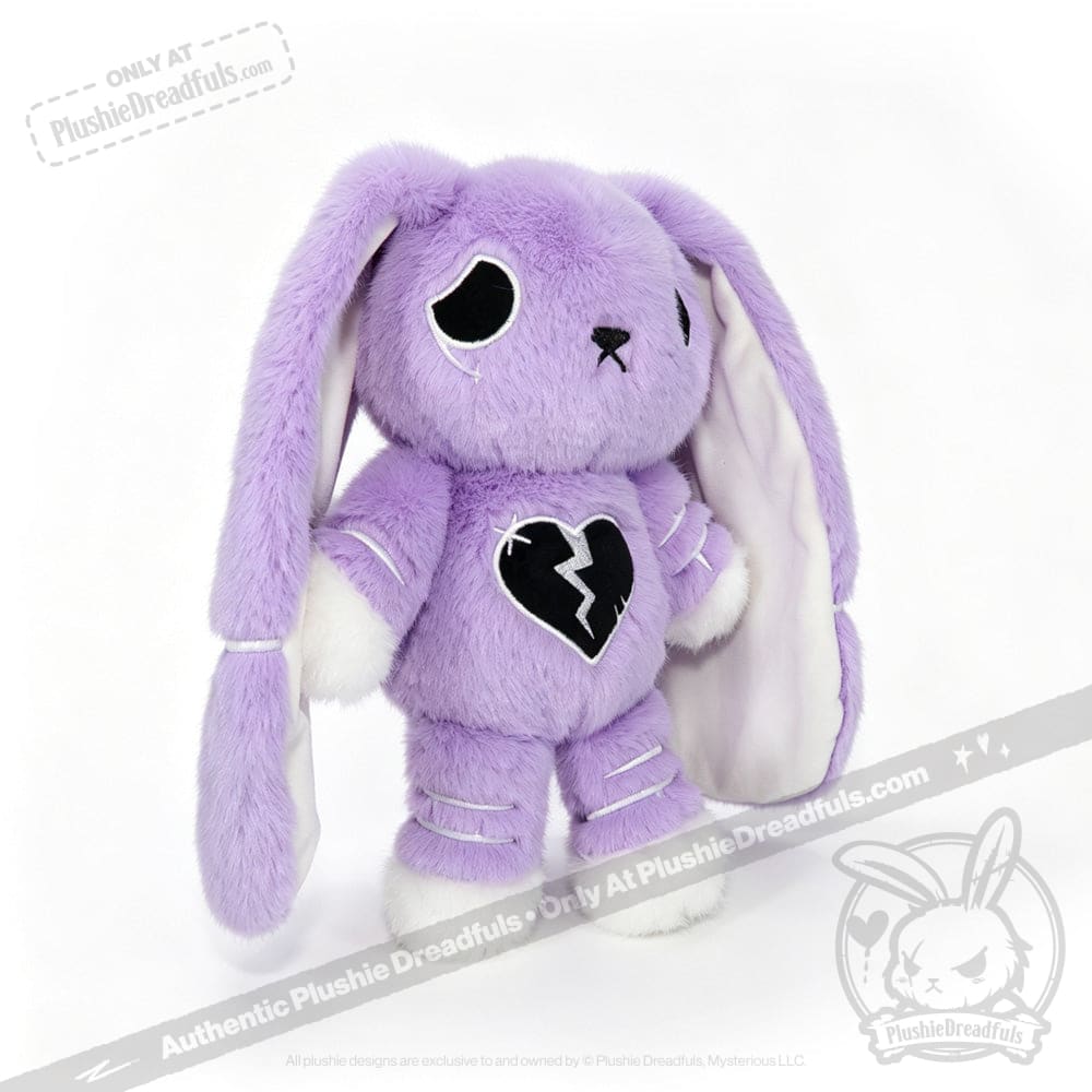 Plush purple bunny with floppy ears, semicolon symbol, broken heart, and black stitched details for depression awareness.