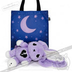 A purple tote bag with moon, stars, and a plush bunny with black heart patch, plus depression awareness details in front.