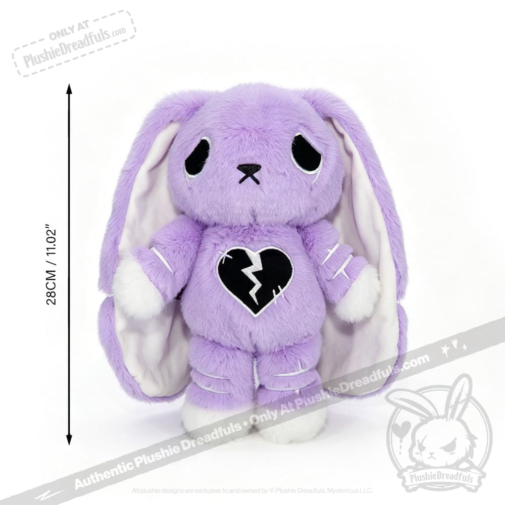 Plush purple bunny with droopy ears, sad eyes, and a semicolon symbol on its chest, 28cm tall. LIMITED EDITION.