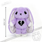 Plush purple bunny with droopy ears, sad eyes, and a semicolon symbol on its chest, 28cm tall. LIMITED EDITION.