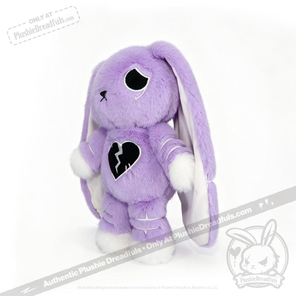 Plush purple bunny with black broken heart, white paws, and a semicolon symbol for depression awareness on its chest.