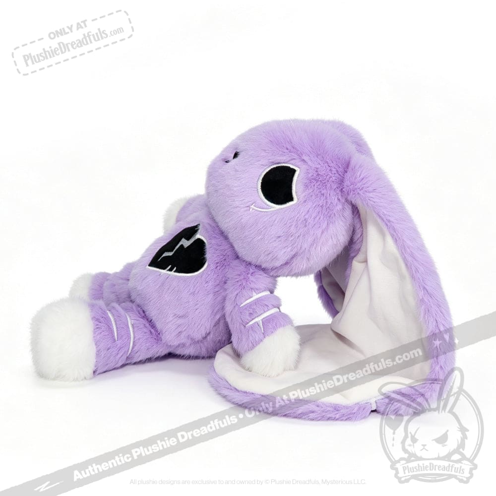 Plush purple bunny with floppy ears and a black heart patch; features a semicolon symbol for depression awareness.