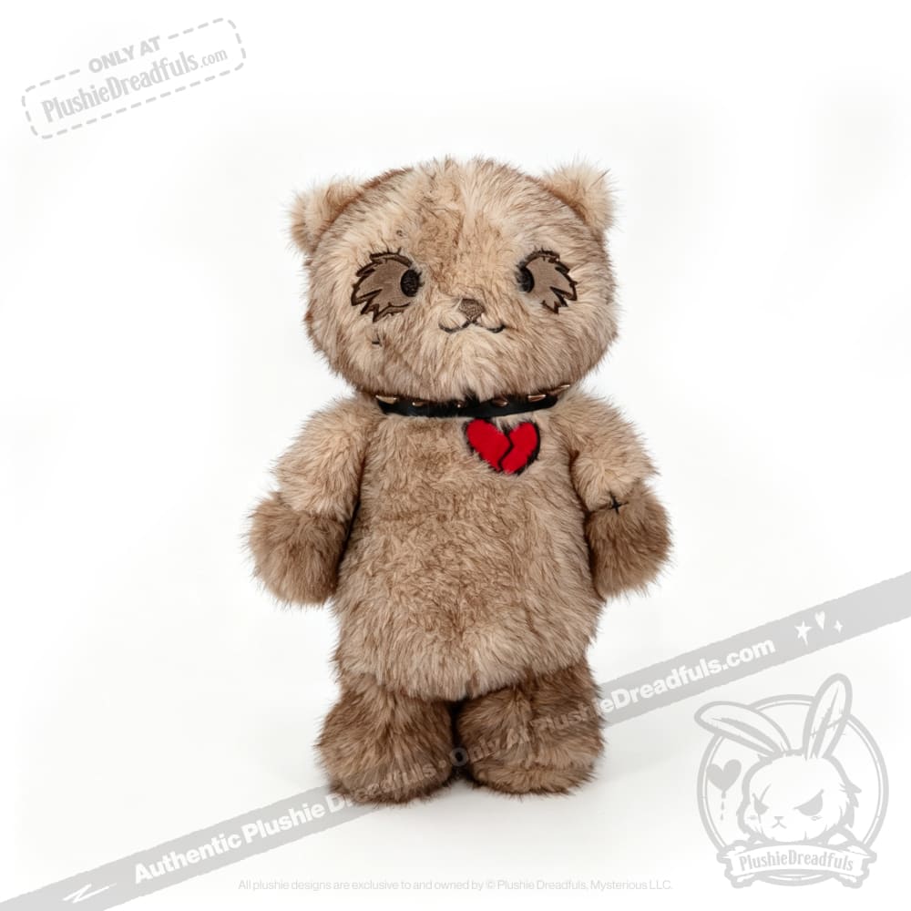 A brown Plushie Dreadfuls bear with a red heart and black collar stands upright on a white background.
