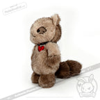 Plush raccoon from Plushie Dreadfuls, standing upright with a black collar and red heart tag, white background.