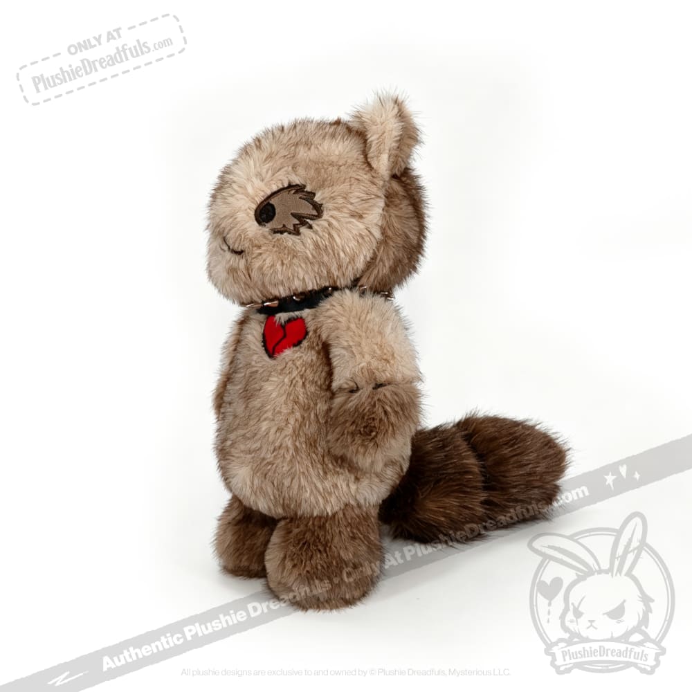 Plush raccoon from Plushie Dreadfuls, standing upright with a black collar and red heart tag, white background.