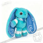 Blue plush Dysautonomia Rabbit with long ears, white accents, and swirls, sporting a small sailor collar.
