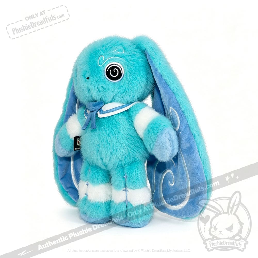 Blue plush Dysautonomia Rabbit with long ears, spiral eyes, and a blue ribbon around its neck on a white background.