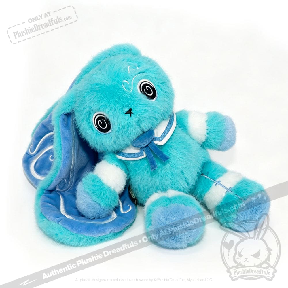 Plush blue Dysautonomia Rabbit with big black eyes, floppy ears, and a blue ribbon on a white background.