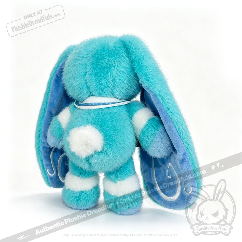 A fluffy blue Dysautonomia Rabbit with long ears, white spots, and a sailor collar, shown from the back.
