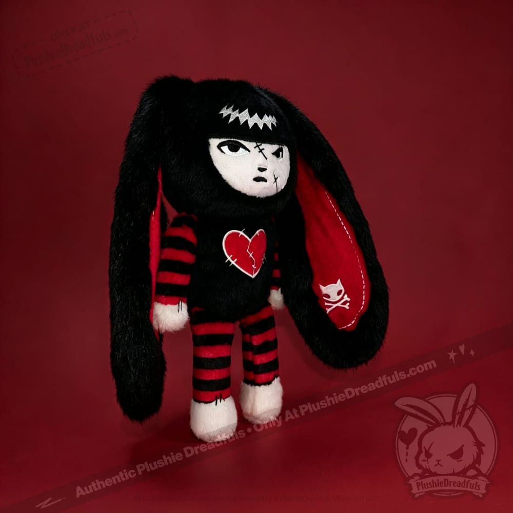 Autographed Emily the Strange and Plushie Dreadful Rabbit collaboration collector set with a black and red goth bunny plush toy, an I Love Cats canvas tote bag, ink pen, coin purse, and signed card by American McGee and Rob Reger.