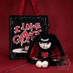 Autographed Emily the Strange and Plushie Dreadful Rabbit collaboration collector set with a black and red goth bunny plush toy, an I Love Cats canvas tote bag, ink pen, coin purse, and signed card by American McGee and Rob Reger.