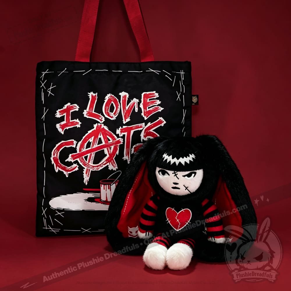 Autographed Emily the Strange and Plushie Dreadful Rabbit collaboration collector set with a black and red goth bunny plush toy, an I Love Cats canvas tote bag, ink pen, coin purse, and signed card by American McGee and Rob Reger.