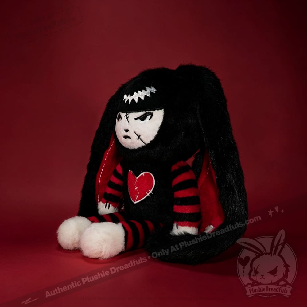Autographed Emily the Strange and Plushie Dreadful Rabbit collaboration collector set with a black and red goth bunny plush toy, an I Love Cats canvas tote bag, ink pen, coin purse, and signed card by American McGee and Rob Reger.
