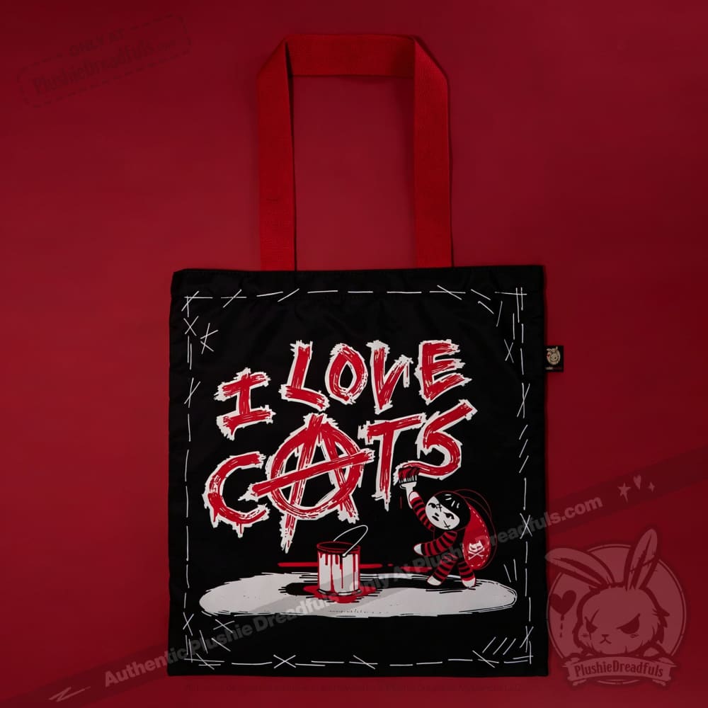 Autographed Emily the Strange and Plushie Dreadful Rabbit collaboration collector set with a black and red goth bunny plush toy, an I Love Cats canvas tote bag, ink pen, coin purse, and signed card by American McGee and Rob Reger.