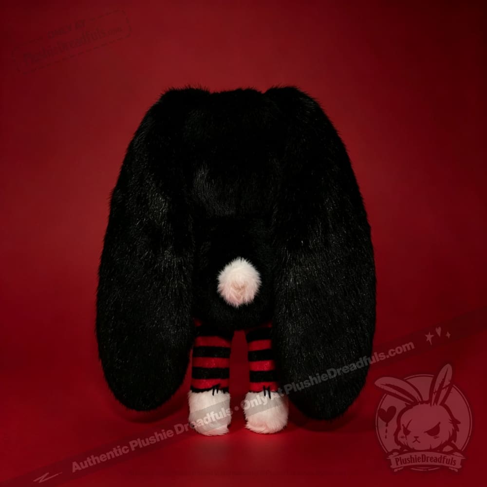 Autographed Emily the Strange and Plushie Dreadful Rabbit collaboration collector set with a black and red goth bunny plush toy, an I Love Cats canvas tote bag, ink pen, coin purse, and signed card by American McGee and Rob Reger.