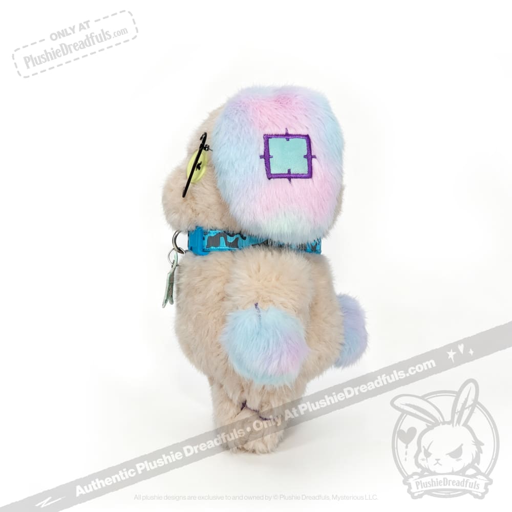 A Plushie Dreadfuls Emotional Neglect Puppy with blue, pink, and cream fur stands on a white background.