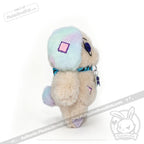 Emotional Neglect Puppy by Plushie Dreadfuls: plush toy with pastel fur, purple-blue accents, on white background.