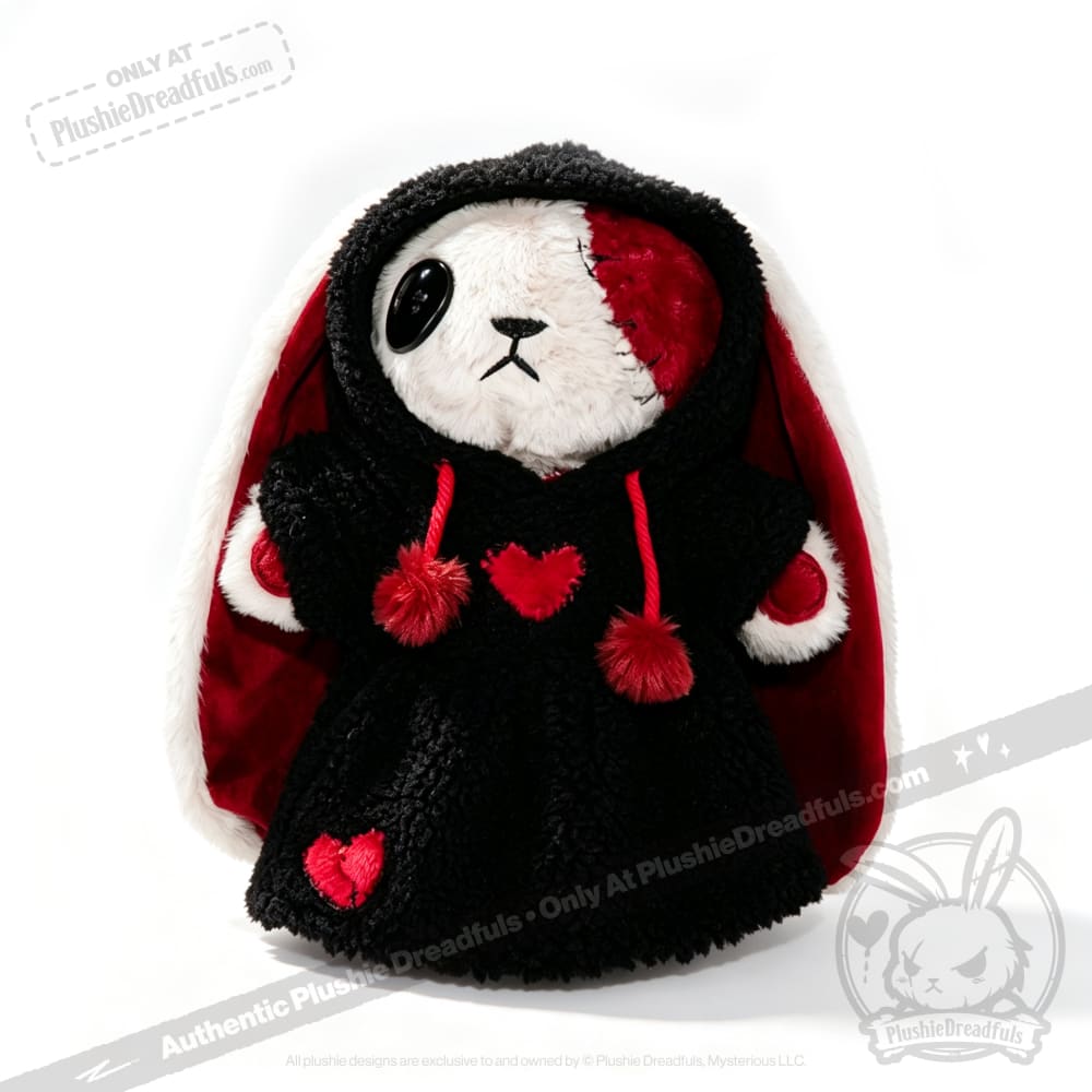 Plushie Dreadfuls bunny in a black plushie hoodie, with red hearts, big ears, and a half-red face.