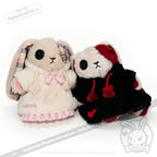 Two Plushie Dreadfuls in Fuzzy Dress Hoodies, one in white and pink, the other in black and red, sit side by side.