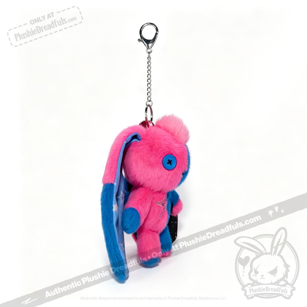 Plushie Dreadfuls Gemini Rabbit keychain in pink and blue, with button eyes, floppy ear, and a sturdy metal clasp.